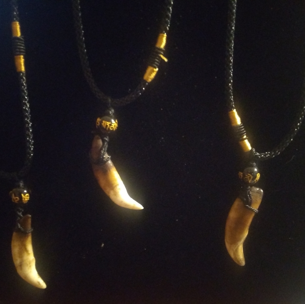 4 wolf's tooth necklaces